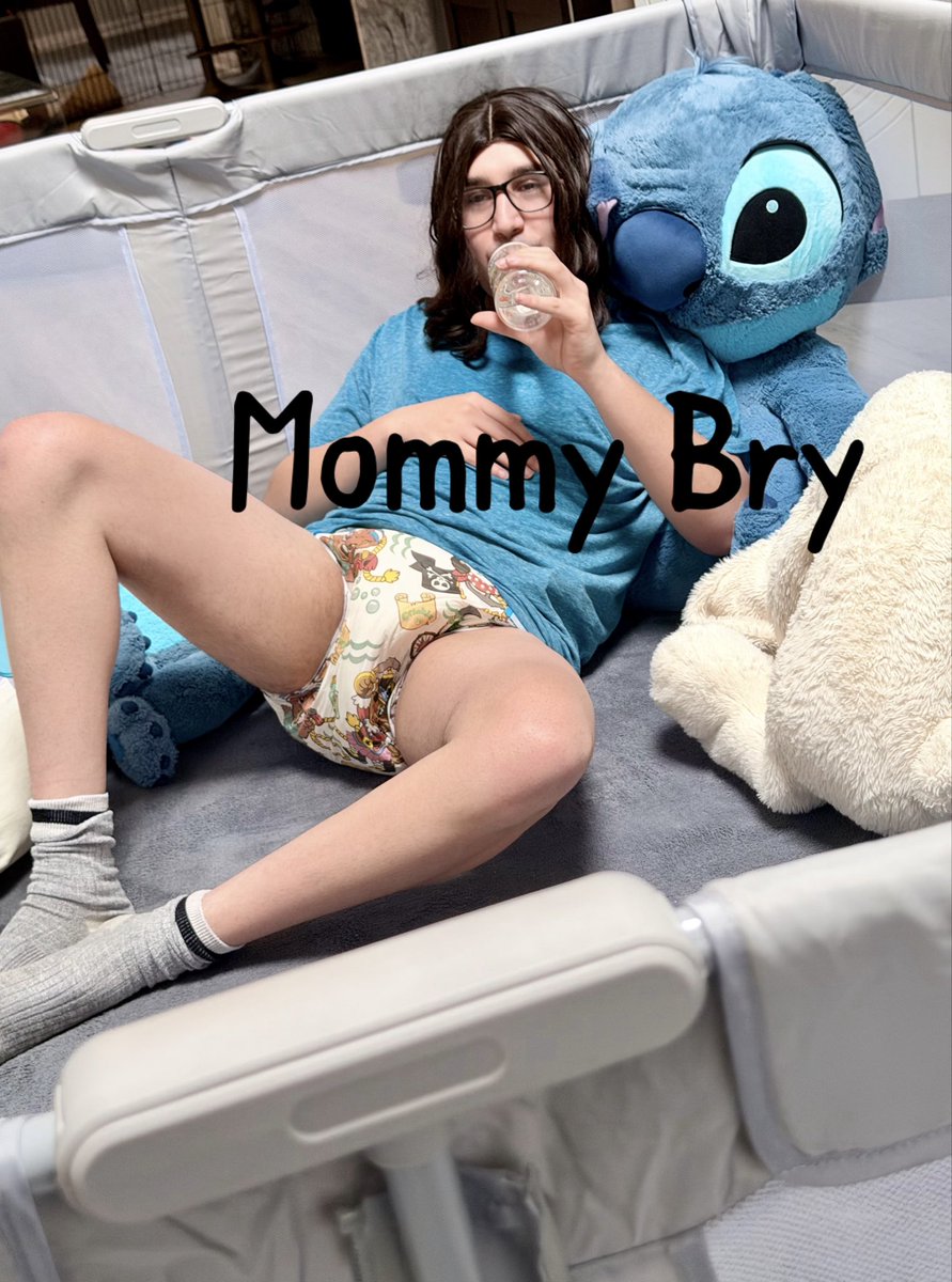 Mommy diaper checking and patting padded bum on baby boy before putting him in playpen #mommy #babyboy #diaper #abdl