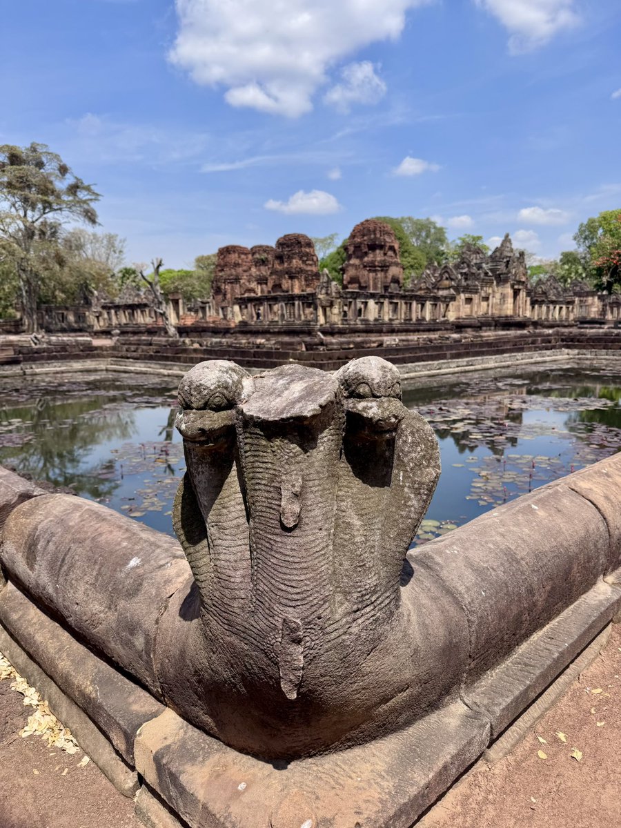 I visited two Thai temples today that deserve more love - Phanom Rung sits on top of a dormant volcano, and is intentionally aligned so the sun rises straight through all 15 doorways on specific days of the year. 

Just below it, Prasat Muang Tam is laid out around four L-shaped