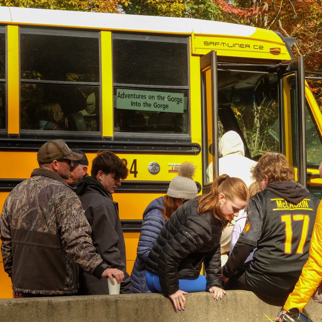 The Bridge Day shuttle is the easiest way to get to the event.  $5 cash takes you to the entrance of the event and back to your car when you're ready