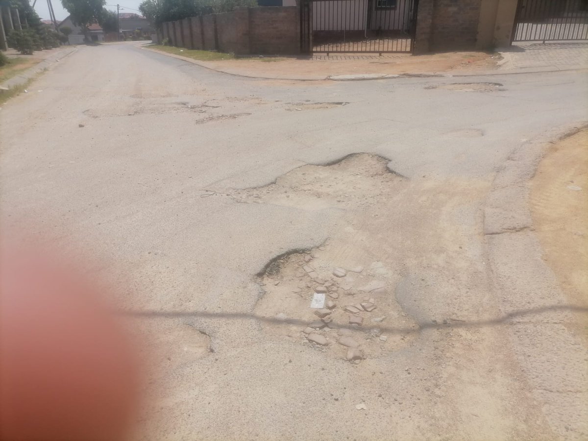 Seathane's tweet photo. @jra 

Good afternoon.
Please assist with potholes in Laso and Philippines Crescent in Cosmo City Ex8.
Attached please see how damaged the streets are. https://t.co/Sizbpozop7
