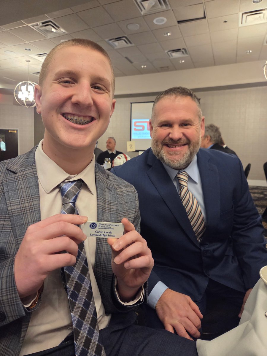 LovelandTigerFB's tweet photo. Congratulations to Loveland High School’s, Calvin Lorek! Finalist for the prestigious “That’s my boy award”, recognition for:
-Football Achievement 
-Academic Achievement 
-School Leadership

*pictured: Head Coach Bob Mullins, and Calvin’s younger brother, Nolan. https://t.co/AeirKuuSDx