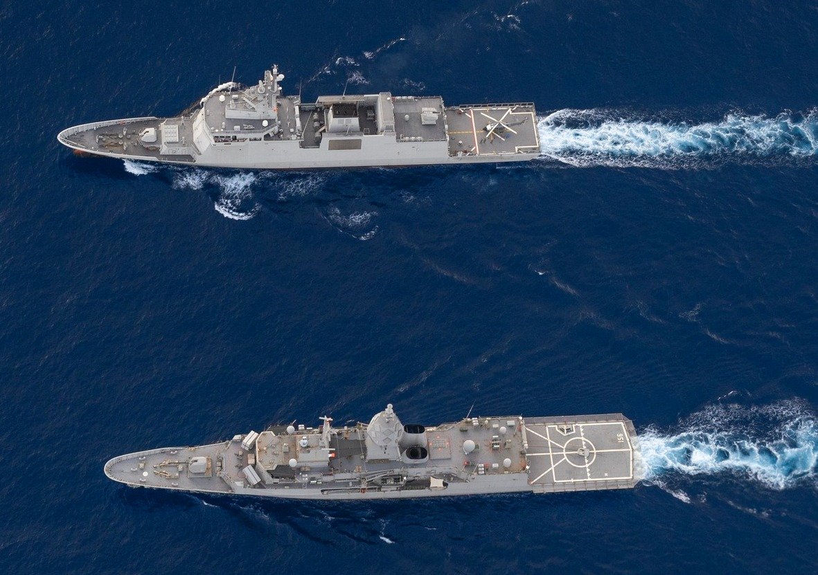 Side by side: The BRP Diego Silang (FFG7) of the Philippine Navy, at the upper part of the image, sails alongside the Royal Australian Navy's HMAS Toowoomba (FFH-156) in the lower part of the image during the 14th Multilateral Maritime Cooperative Activity in the West Philippine