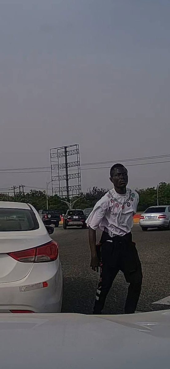 elormhood's tweet photo. Phone Snatching Incident Reported at Achimota Forest Overhead Roundabout in Accra

Accra, Ghana – Motorists are being urged to exercise heightened vigilance following a reported phone snatching incident at the busy Achimota Forest overhead roundabout.

According to an eyewitness account shared on social media, a female driver had her mobile phone stolen while stuck in traffic at the location. The theft reportedly occurred in broad daylight, with the perpetrator swiftly grabbing the device from the victim before fleeing the scene.

The witness, who was positioned directly behind the affected vehicle, captured video footage of the incident and shared clear snapshots of the suspected thief. The material has been circulated online in an effort to aid identification and prompt action.

“Please, everyone: always roll up your windows and stay alert when you're in traffic, especially around that area. Don't let yourself become the next victim,” the eyewitness advised in the post.

The Ghana Police Service has been publicly tagged and called upon to investigate the matter urgently and apprehend the suspect to prevent further occurrences in this high-traffic zone, which has seen recurring reports of similar opportunistic crimes.