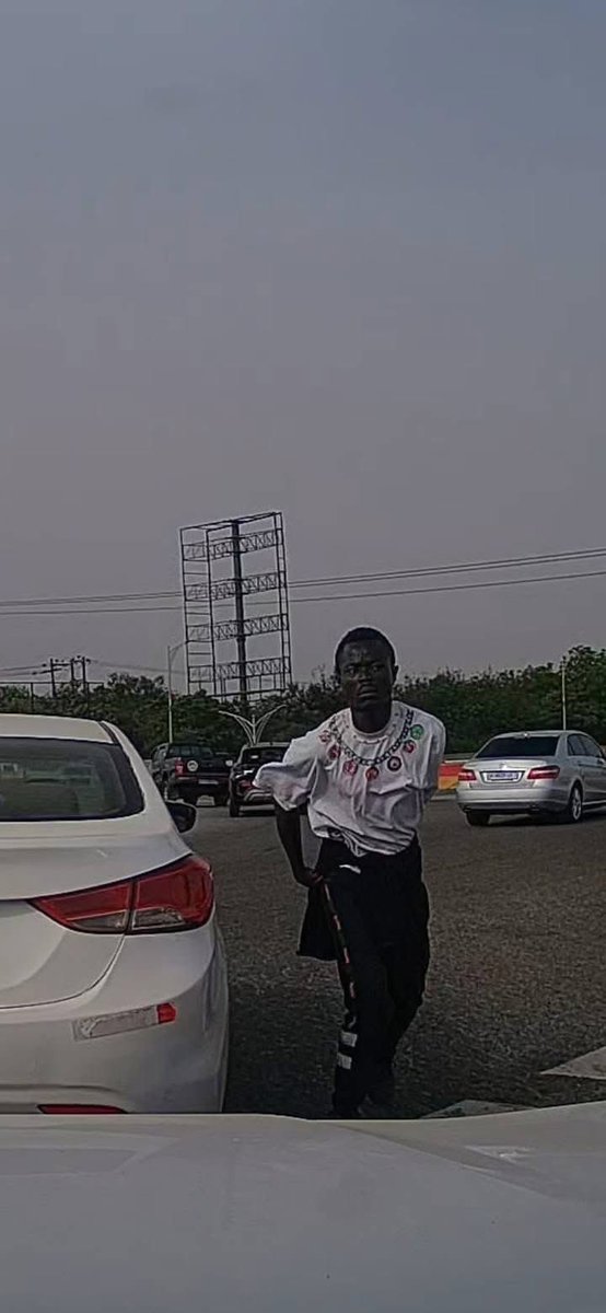elormhood's tweet photo. Phone Snatching Incident Reported at Achimota Forest Overhead Roundabout in Accra

Accra, Ghana – Motorists are being urged to exercise heightened vigilance following a reported phone snatching incident at the busy Achimota Forest overhead roundabout.

According to an eyewitness account shared on social media, a female driver had her mobile phone stolen while stuck in traffic at the location. The theft reportedly occurred in broad daylight, with the perpetrator swiftly grabbing the device from the victim before fleeing the scene.

The witness, who was positioned directly behind the affected vehicle, captured video footage of the incident and shared clear snapshots of the suspected thief. The material has been circulated online in an effort to aid identification and prompt action.

“Please, everyone: always roll up your windows and stay alert when you're in traffic, especially around that area. Don't let yourself become the next victim,” the eyewitness advised in the post.

The Ghana Police Service has been publicly tagged and called upon to investigate the matter urgently and apprehend the suspect to prevent further occurrences in this high-traffic zone, which has seen recurring reports of similar opportunistic crimes.