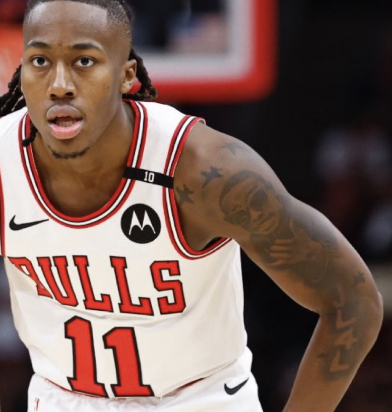 AmyHockert's tweet photo. Just learned @Timberwolves Ayo Dosunmu's tattoo is best friend Darius Brown. Darius was 13 when he was shot/killed playing bb at a park in Chicago. "Every time we do something big we throw our jets up just for him. Make sure he understands that he's right here with us.” 💚💙 https://t.co/sxQWdxc4dn