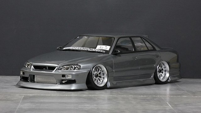 HobbyBank's tweet photo. パンドラRCのER34 SKYLINE 4Drが復活！
純正ボンネット��姿を変え新登場。長い期間生産停止となっていたER344Drが、ユーザーの熱い希望により待望の復活となります。【3月下旬発売】
https://t.co/m41znabOAM https://t.co/QFdwhS3ybN