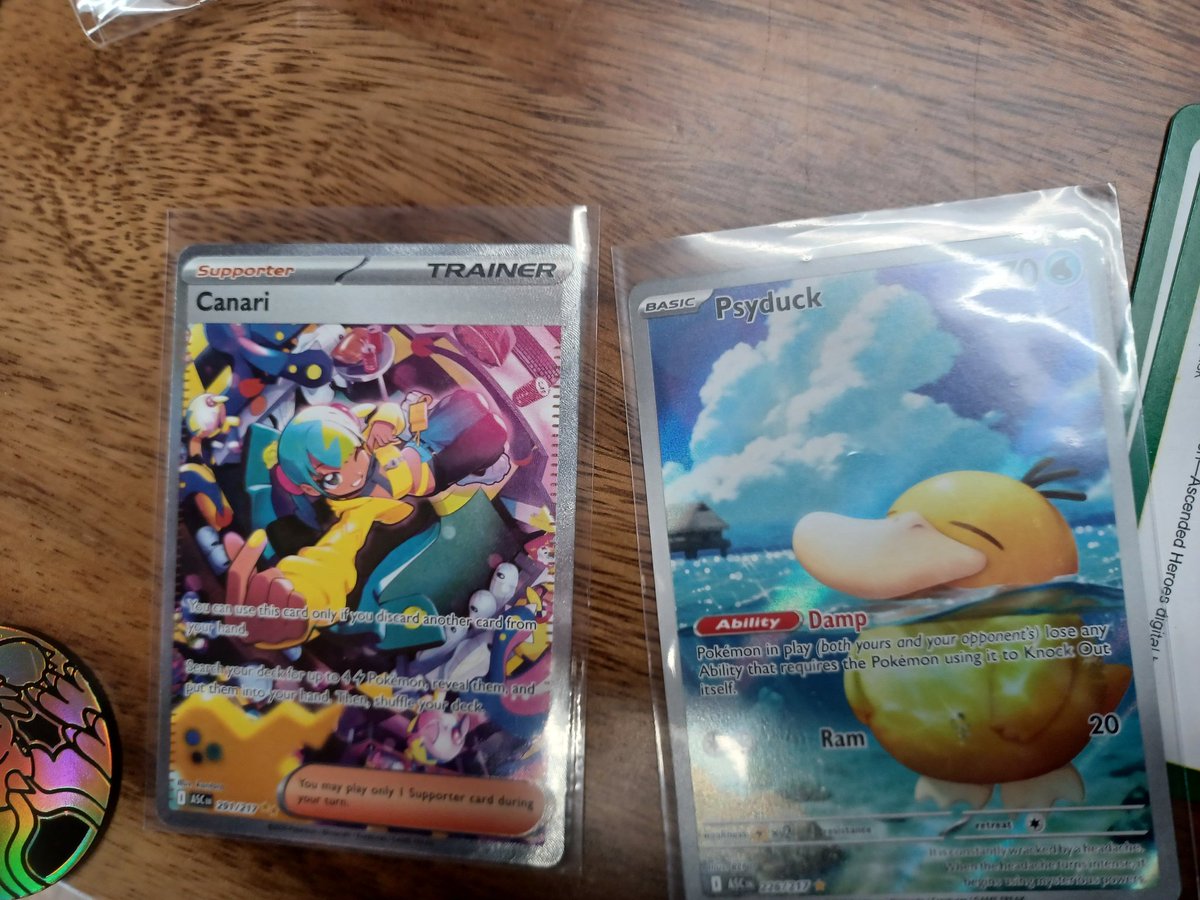 John_Sam_Knight's tweet photo. @Nerd_Gasms I only got a Mini tin and ETB but got the IR psyduck and canari ( two of my chase cards) in my tiny island  town https://t.co/rIA3XLlF1N