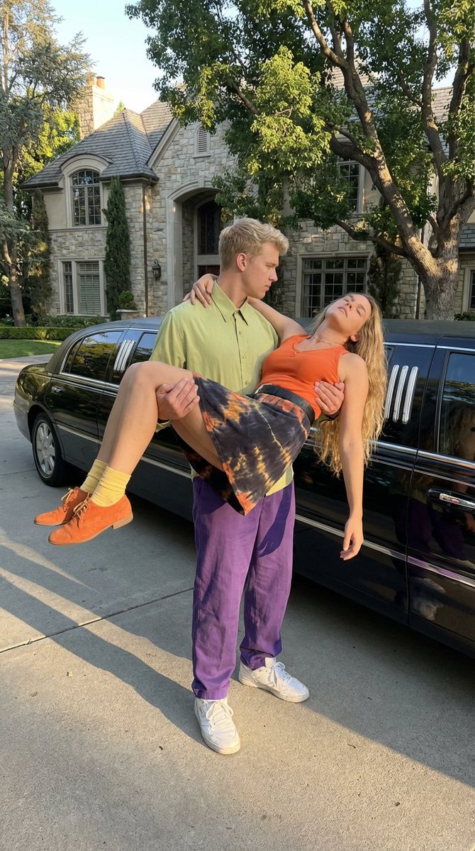 TMC1982's tweet image. @NicoleEggert Here's a @metaai generated image that's inspired by the scene in #CoreyHaim's film, "#TheDouble0Kid" (1992), where #NicoleEggert's character is being bridal carried while she's unconscious after is shot in the neck by @brigittenielsen's tranquilizer darts.