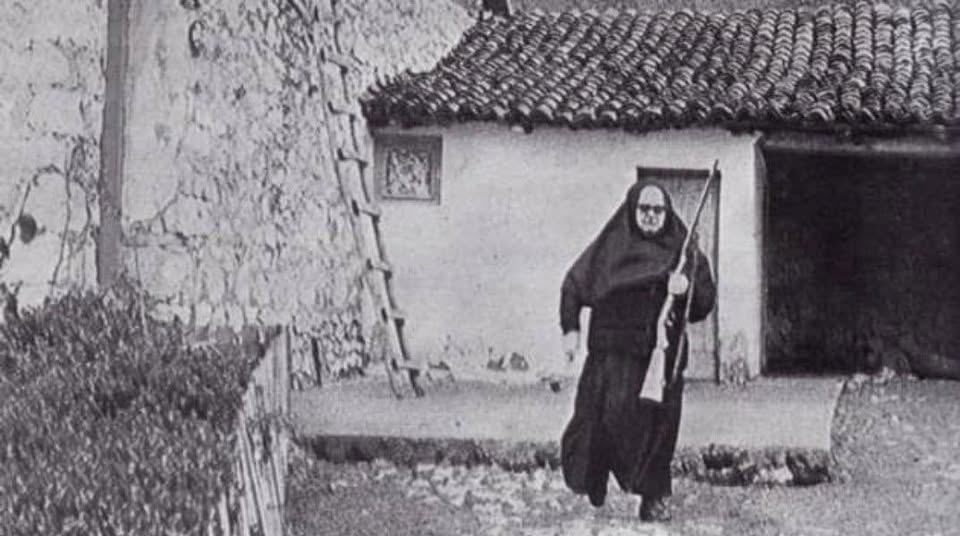 Epic  photo from 1980 in Kosovo and Metohia. Nun Ilaria standing guard,  protecting a Serbian Orthodox monastery from Albanian Muslims.