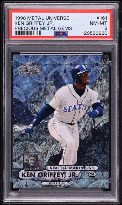 90s grails still move the needle. This 1998 Metal Universe PMG Ken