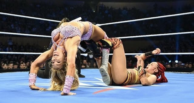 S2lWrestling's tweet image. Flair locks the Figure Four, bridging into the Figure 8 on Chelsea!! Nikki dives in and tries to pin Flair while she has it locked in 

1…2… Charlotte kicks out!

Charlotte gets up quickly and takes Nikki down hitting her with Natural Selection!

1…2…3!! Flair @aescado wins!!