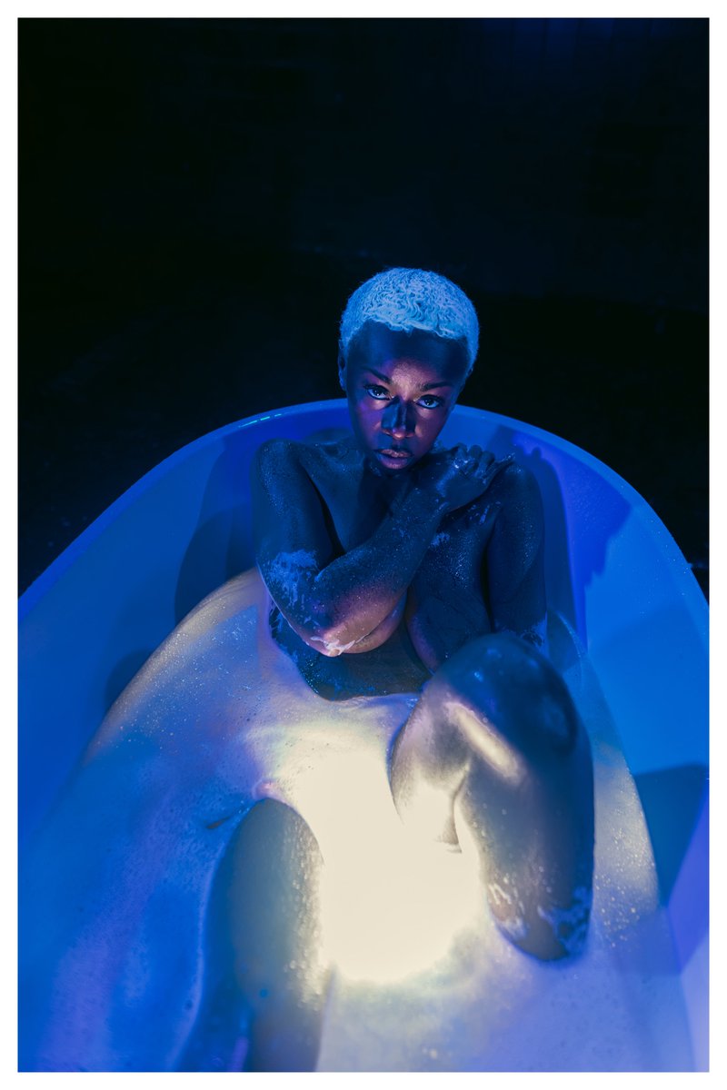 Arms folded over her heart like a guarded flame, yet her eyes burn straight into mine demanding, devouring. In this blue abyss, <a href="/mingosmedia/">Clinton Mingo</a> and <a href="/zazathebody_/">ZA</a> share a silence thicker than desire skin glistening, souls colliding in quiet fire. Deep. Unyielding. #DeepSensualNude