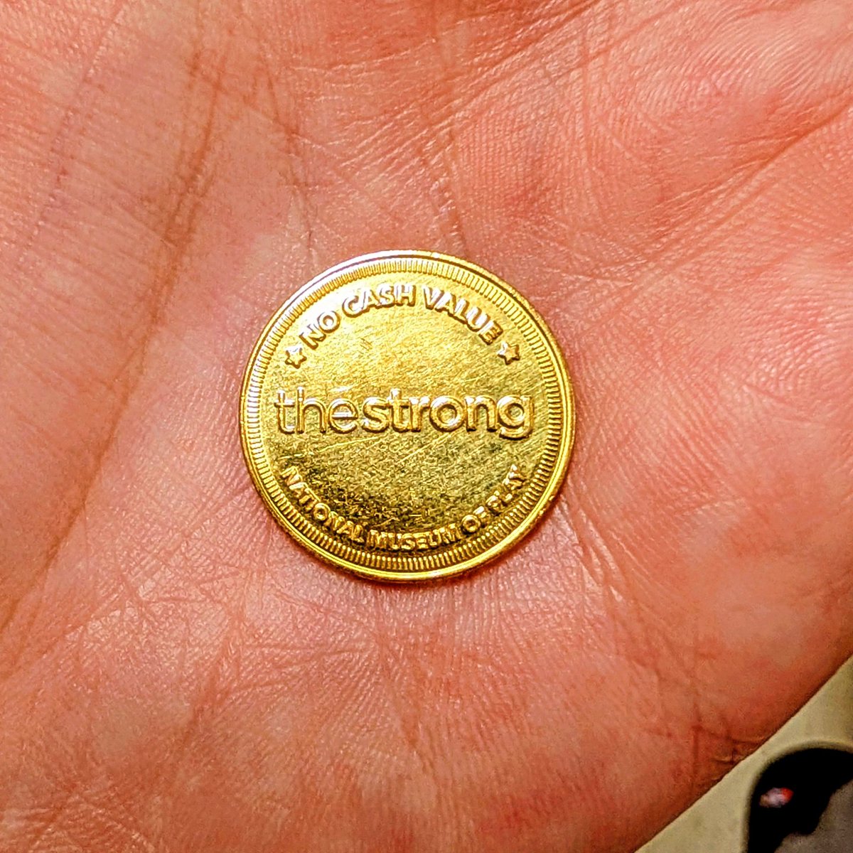Found an arcade token at the Goodwill bins.

World Video Game Hall of Fame, Rochester, NY.

How does something travel from a museum arcade to Columbus, Ohio?