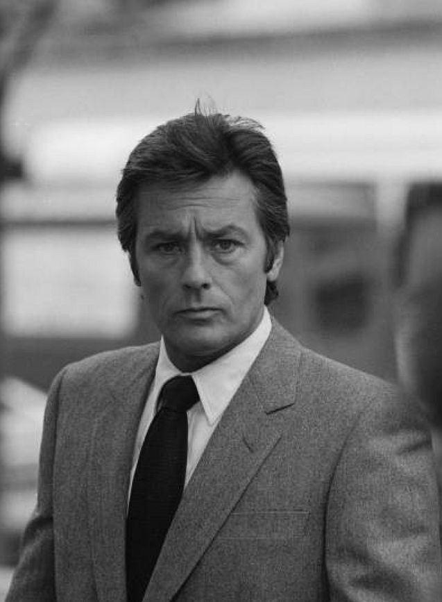 Alain Delon - no smirking, no winking, just pure, untouchable detachment, as if emotion is something that happens to other people.