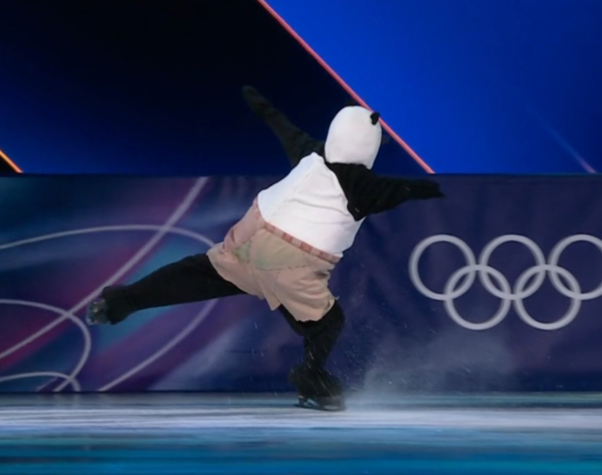 the concept of jumping a triple toe in a panda costume at the olympic games