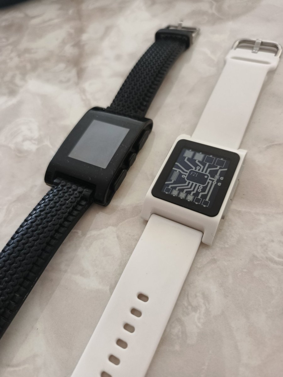 My old first Pebble (not working) and my new first Pebble. I love how similar and how different they are. Thank you <a href="/Pebble/">Pebble</a> and <a href="/ericmigi/">Eric Migicovsky</a> to bring this to life.