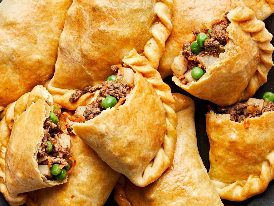 Empanadas 

Empanadas are those delicious **handheld pastries**—flaky, golden pockets of dough stuffed with savory (or sometimes sweet) fillings. They're a beloved street food and home-cooked staple across Latin America, Spain, and beyond, with endless regional variations.

###