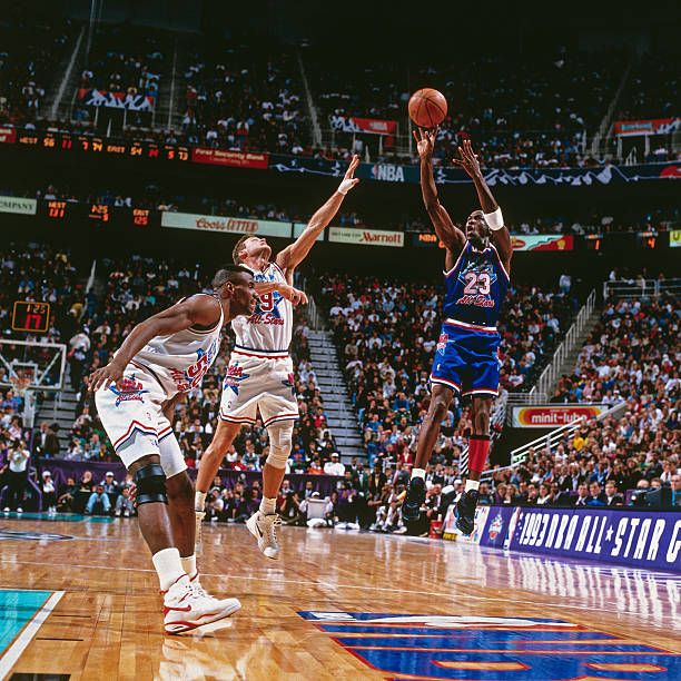 Michael Jordan shoots the fadeaway over defender Dan Majerle. 1993