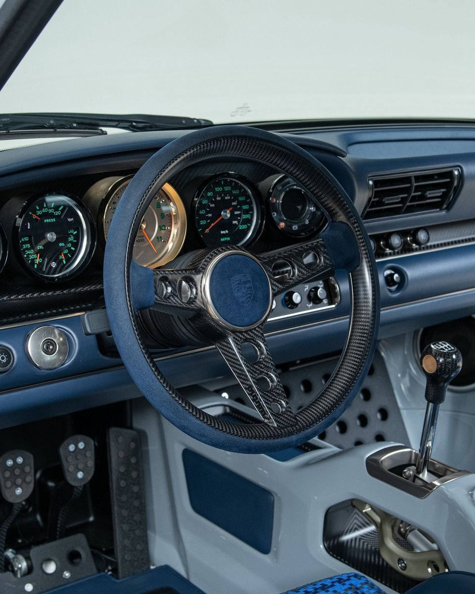 duPontREGISTRY's tweet photo. 1990 Porsche 911 Singer DLS "Dynamics & Lightweighting Study" | One of 75 examples created by Singer Vehicle Design

This 911 represents the pinnacle of naturally aspirated Porsche engineering. At its heart is a 4.0-liter air-cooled flat-six, producing 500 horsepower and revving to 9,000 rpm, developed in collaboration with Williams Advanced Engineering and the legendary Hans Mezger.

Weighing approximately 2,200 lbs thanks to extensive use of carbon fiber, magnesium, and titanium, it features Williams-engineered suspension, Brembo carbon-ceramic brakes, advanced aerodynamics, a Hewland magnesium 6-speed manual, and BBS magnesium center-lock wheels. Finished in Sport Classic Grey with ghosted stripes over a Dark Navy interior, showing just 1,337 miles since completion, and protected by full PPF, this Singer is a masterclass in lightweight design, precision, and craftsmanship.

Learn more: https://t.co/B7Xl5dX7mD