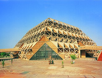 The Hall of Nations used a space frame for both the roof and inclined walls, creating a vast 246×246 ft column-free hall, 81 ft high.

Remarkably, it was built in reinforced concrete rather than steel - likely one of the only significant examples of its kind in the world. 4/9