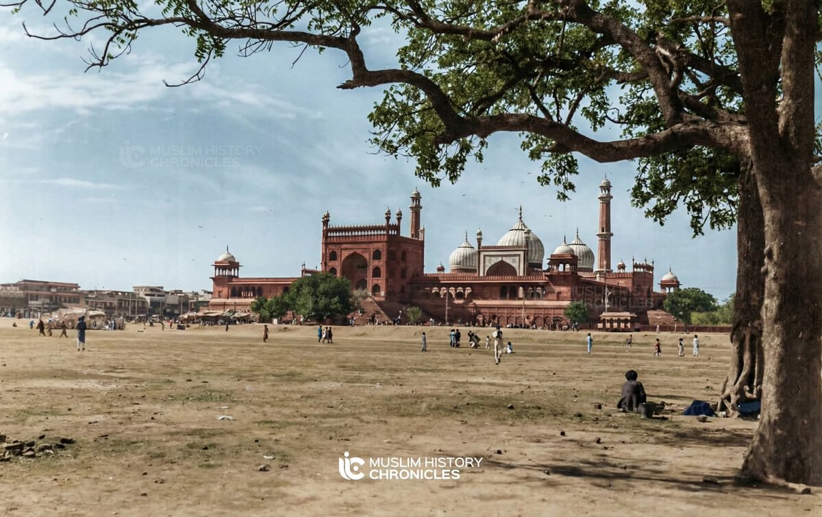mhchroniclesx's tweet photo. Delhi's Jama Masjid, pictured around 1910

This colorized photograph captures the magnificent Jama Masjid in a rare moment of serene grandeur. 

Long before the modern chaos of honking rickshaws and dense storefronts, the mosque stood as a quiet sentinel over the vast, dusty Maidan.

The people scattered across the foreground, some resting in the shade, others crossing the open expanse, offer a hauntingly beautiful sense of scale and the slow pace of life in a city on the cusp of a massive historical transformation.

1910 was the last year of "Old Delhi" being the primary city. In 1911, King George V would visit for the Delhi Durbar, and construction on "New Delhi" (Lutyens' Delhi) would begin shortly after, forever changing the city's layout.

(Disclaimer: This photo has been colorized using LLMs. Find the original photograph in the comments.)