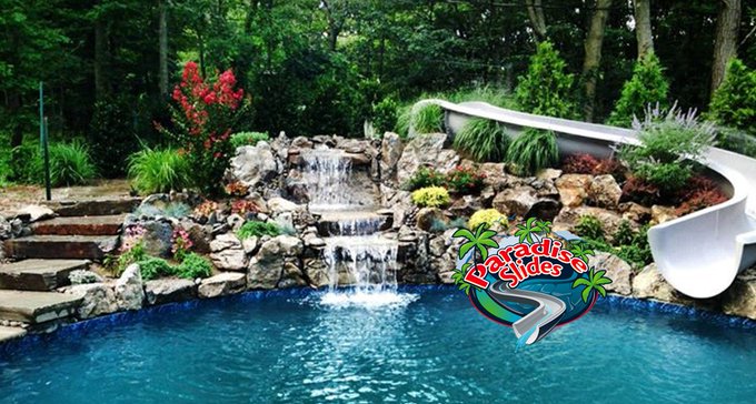 🌳Turn your backyard into a natural oasis with this stunning Paradise Slides setup! Curving gracefully through rocky waterfalls, lush plants, and cascading streams before splashing into crystal-clear waters. Who's ready to make their pool this epic? 🏞️🌊Discover more at