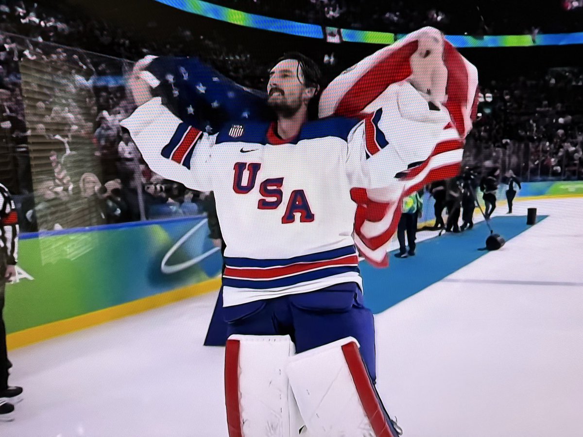 There’s just something about a goalie skating around the ice with their helmet off and an American flag draped around their shoulders 🥇