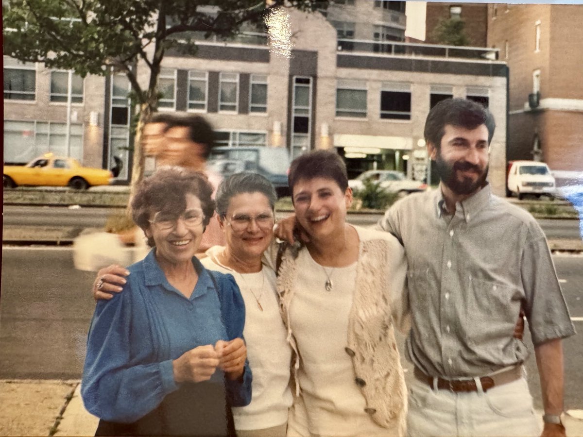 Mom, dad , grandma and friend. Not sure of timing but looks like across from World Trade Center