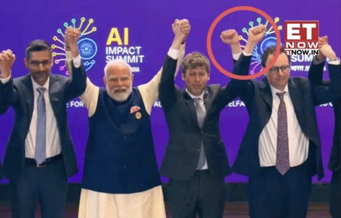tim_ai_events's tweet photo. A viral post from the India AI Impact Summit showing Sam Altman and Anthropic CEO Dario Amodei sparked viral posts — feeding into the broader competitive narrative between major AI research orgs and fueling attention on leadership moves like OpenClaw talent integration. https://t.co/u7tacWZQWH