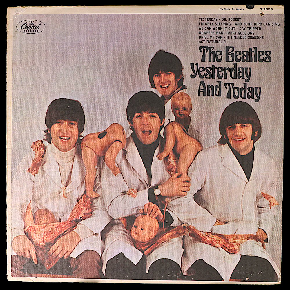 Cover of The Beatles' album from 1966 “Yesterday and Today” shows the band in white coats holding raw meat and decapitated baby dolls.