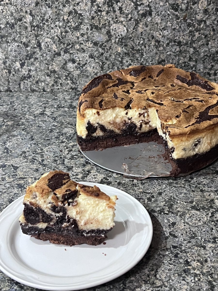 vanilla bean brownie cheesecake.. bottom layer of chocolate tart crust, with a molten brownie layer on top and vanilla baked cheesecake with brownie swirls.. it’s just as decadent as it sounds