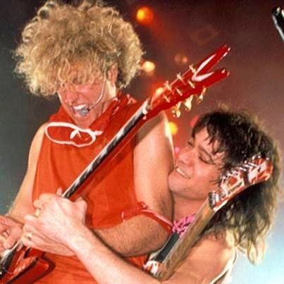 Sammy Hagar and Eddie Van Halen. Photo by Ebet Roberts  at the inaugural Farm Aid concert on September 22, 1985, in Champaign, Illinois. At this show, Hagar announced that he was the new lead singer for Van Halen, and they performed a cover of Led Zeppelin's "Rock and Roll".