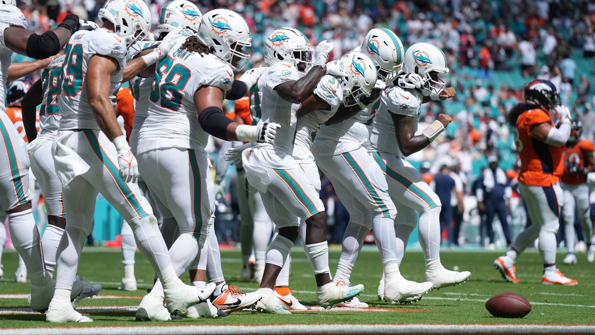 ShoutoutKG's tweet photo. Now that everyone from this photo, including the head coach and general manager are off the Dolphins, can we all admit that not breaking the record “for karma” was a stupid idea. https://t.co/ByeVZUJZXL