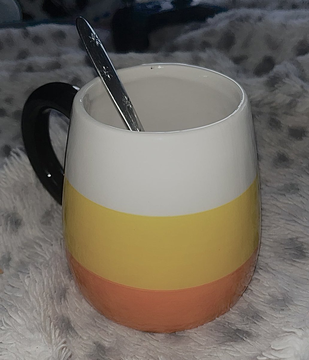 GUYS IM DRINKING MY TEA OUT OF A CANDY CORN !!!!!!!! ITS SO CUTE LOOK I LOVE MY MUG !!!!