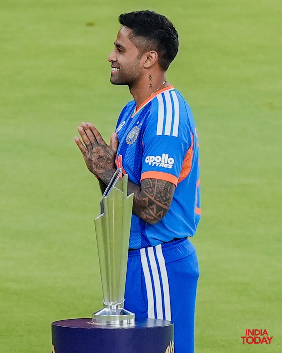 IndiaToday's tweet image. India's captain Suryakumar Yadav poses for a picture with the trophy on the eve of the ICC Men's T20 World Cup 2026 final cricket match between India and New Zealand, at the Narendra Modi Stadium, in Ahmedabad, Gujarat.

#SuryakumarYadav #T20WorldCup
#INDvsNZ #ITPhotoBlog