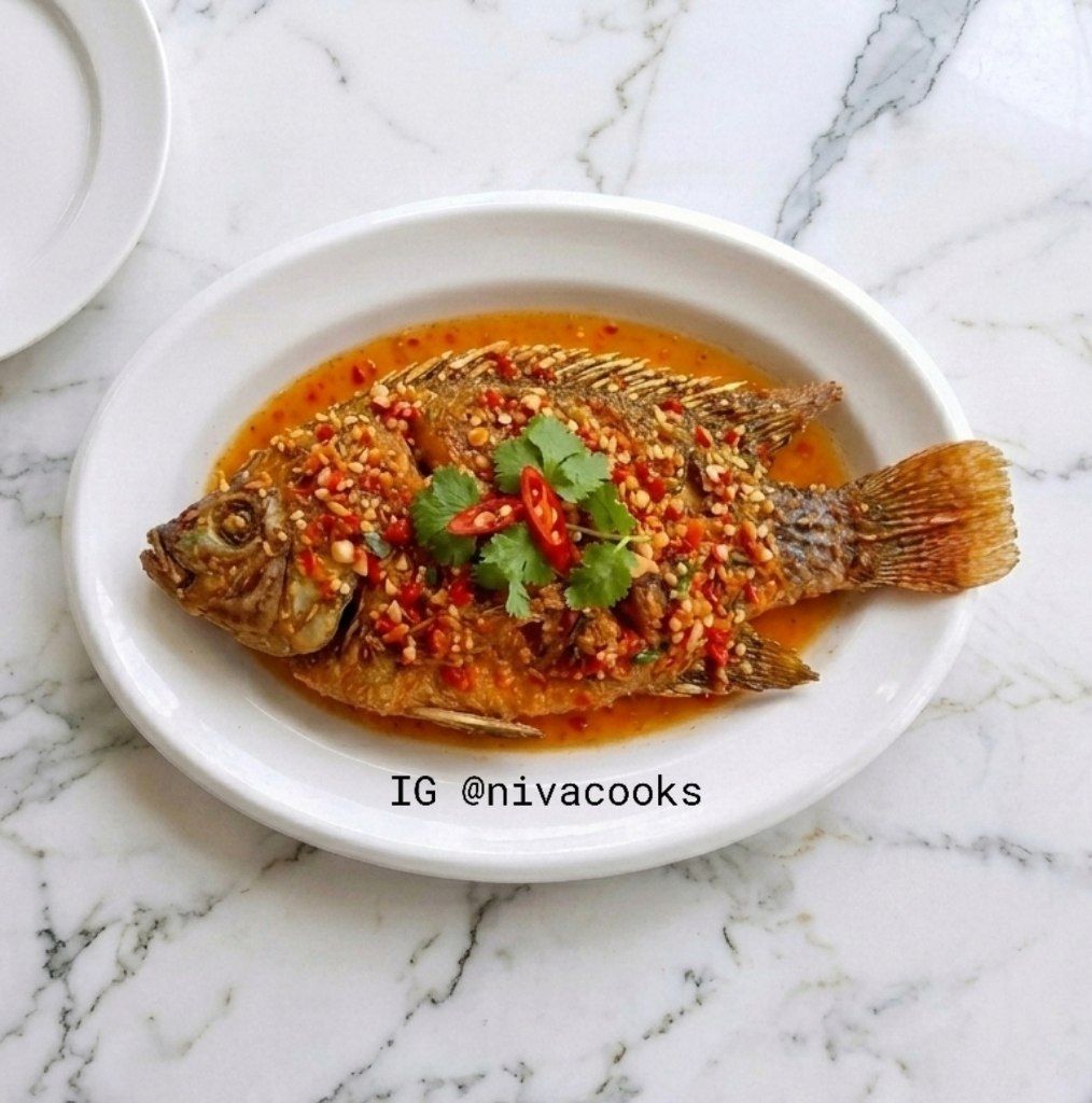 nivacooks's tweet photo. Meet Pla Tub Tim Rad Prik—shatteringly crispy Red Tilapia drowned in a sticky, spicy, sweet, and sour chili glaze. It’s a literal flavor explosion that’ll make your takeout menus feel neglected. 
Grab the full, printable recipe here: https://t.co/q8yRoOz216
#NivaCooks #ThaiFood https://t.co/doIzvsCKXb