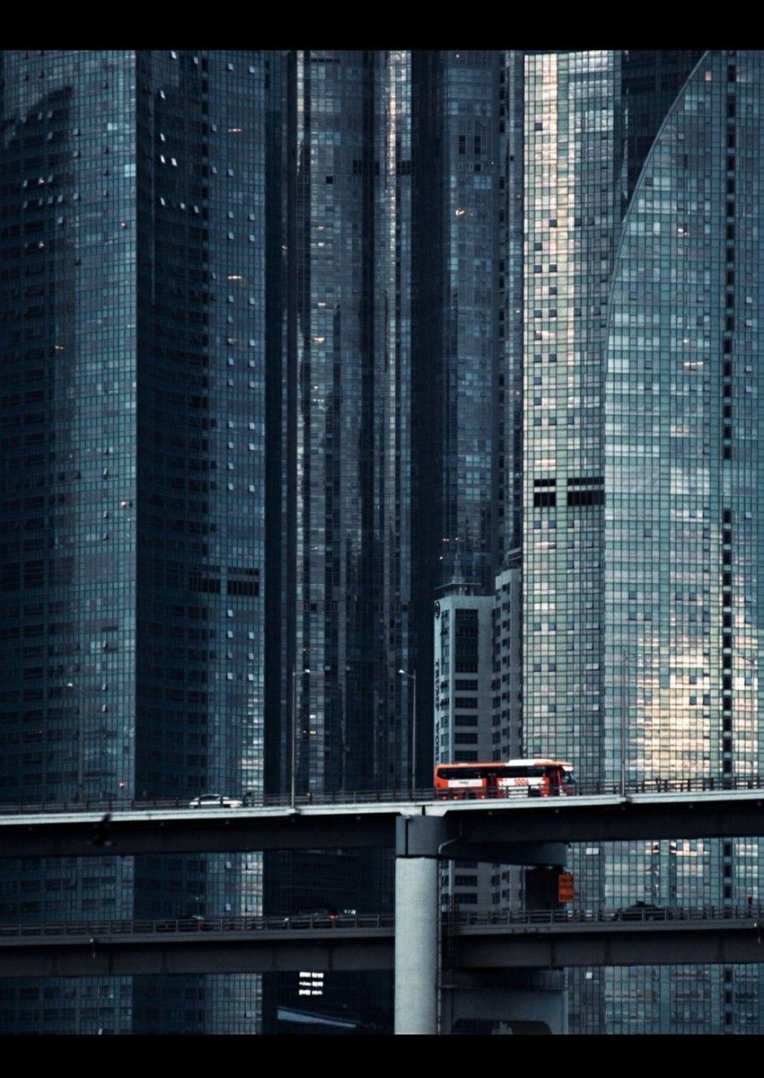 mikewalsh's tweet photo. The old world had walls. Stone ramparts and watchtowers marking the boundary between the city and the chaos beyond. But in the modern metropolis the walls dissolved into the city itself. The power grid, the fiber lines, the satellites overhead, the glass towers where millions live stacked in the sky. When drones strike a substation or slam into a residential high rise, they are not breaching the perimeter. They are hitting it. Because in a networked world the walls that once protected the city have become the city. And now we live in a society without a perimeter.