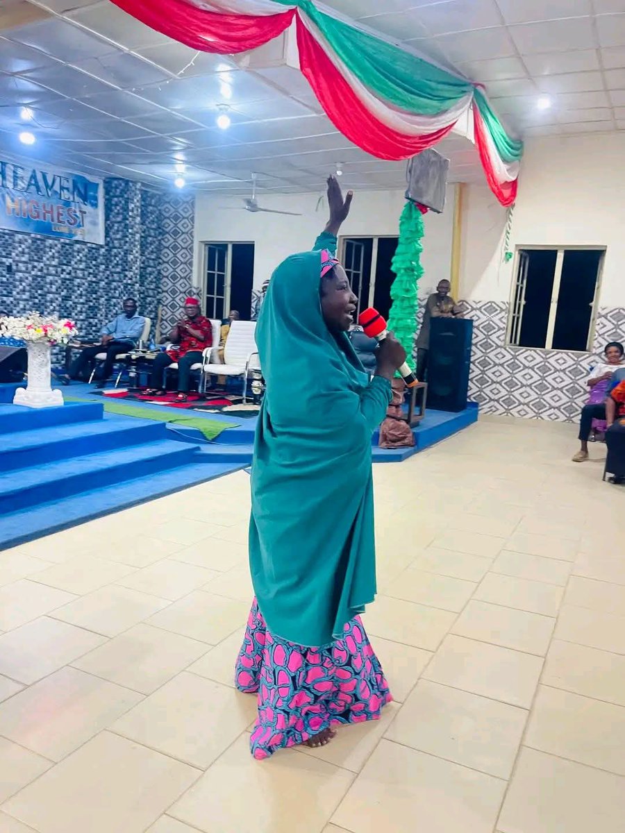 ana_herleemerh's tweet photo. They claim she converted from Islam 2 Christianity, but her actions, kneeling, raising her hand, and holding the mic – and her hijab style don't match that narrative, not agending, not cooperating. Wearing a hijab doesn't automatically make someone a Muslim, and not al Muslims wear hijab. Hijab means 'cover'; it's about modesty, not just one style.

 The person behind this should consult Prof. Daud on how Christians are sponsor to learn about Muslim practices in Islamic countries so as to deceive Muslims.  he was one of the top Christians, well sponsored by the west to do all this deceptions before Allah saved him to embrace Islam some years back.

She needs a better script.
Islam is not a man made religion, the owner has promised to protect his deen by himself till the end of the world.