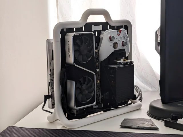 FrameworkPuter's tweet photo. Wild portable Framework Laptop 13 + eGPU setup by MPKVR.  And the files are available for you to print your own!  https://t.co/3ueKVOajzu https://t.co/0h5eqnnCDh