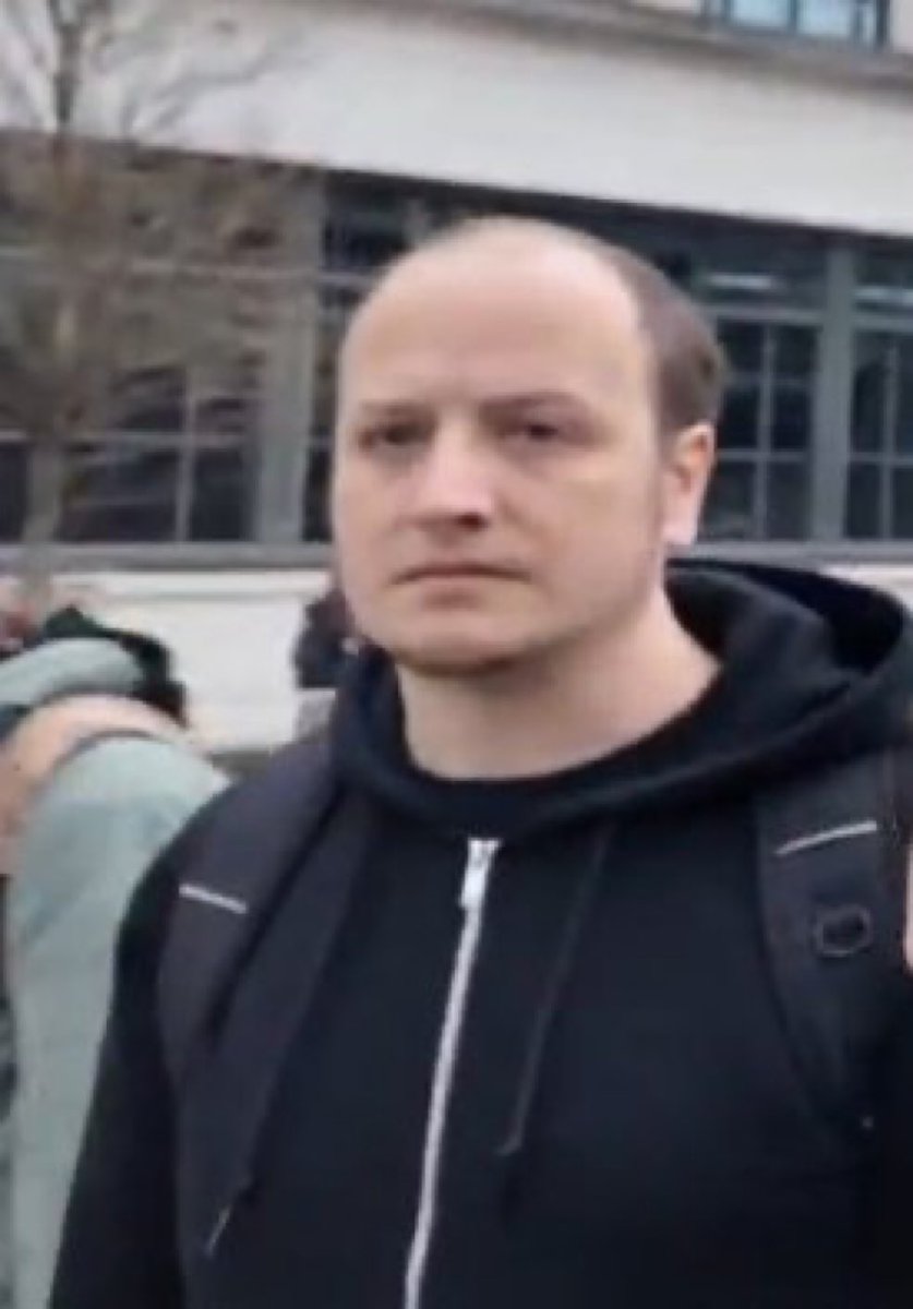 Who is this thug?

Who employs him?