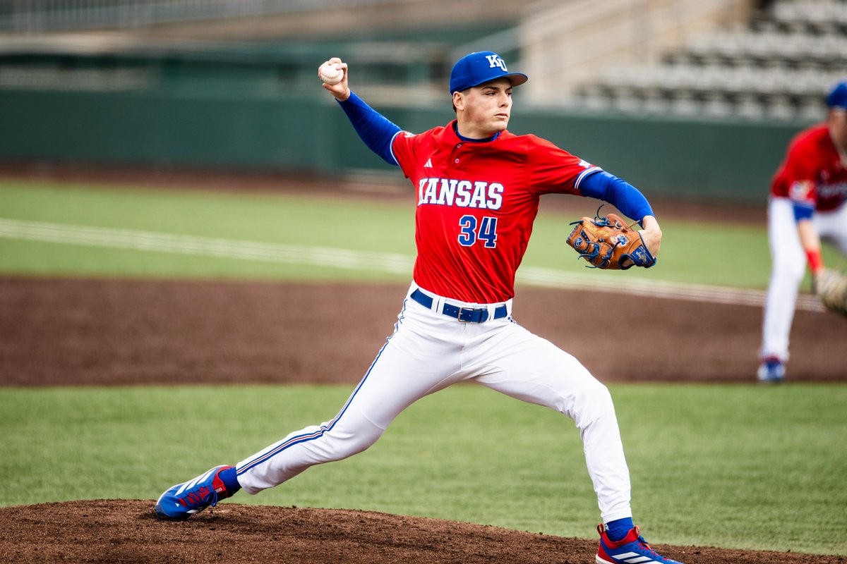 Baseball #Jayhawks wearing the blue KU script caps, red jerseys