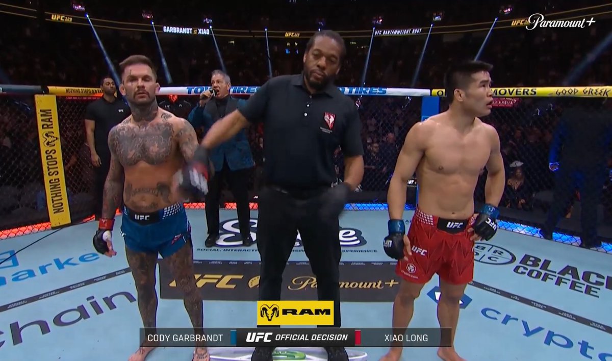 TheUFCStats's tweet photo. Herb Dean looks disgusted raising Cody's hand 💀 https://t.co/jOBW7m9u8s