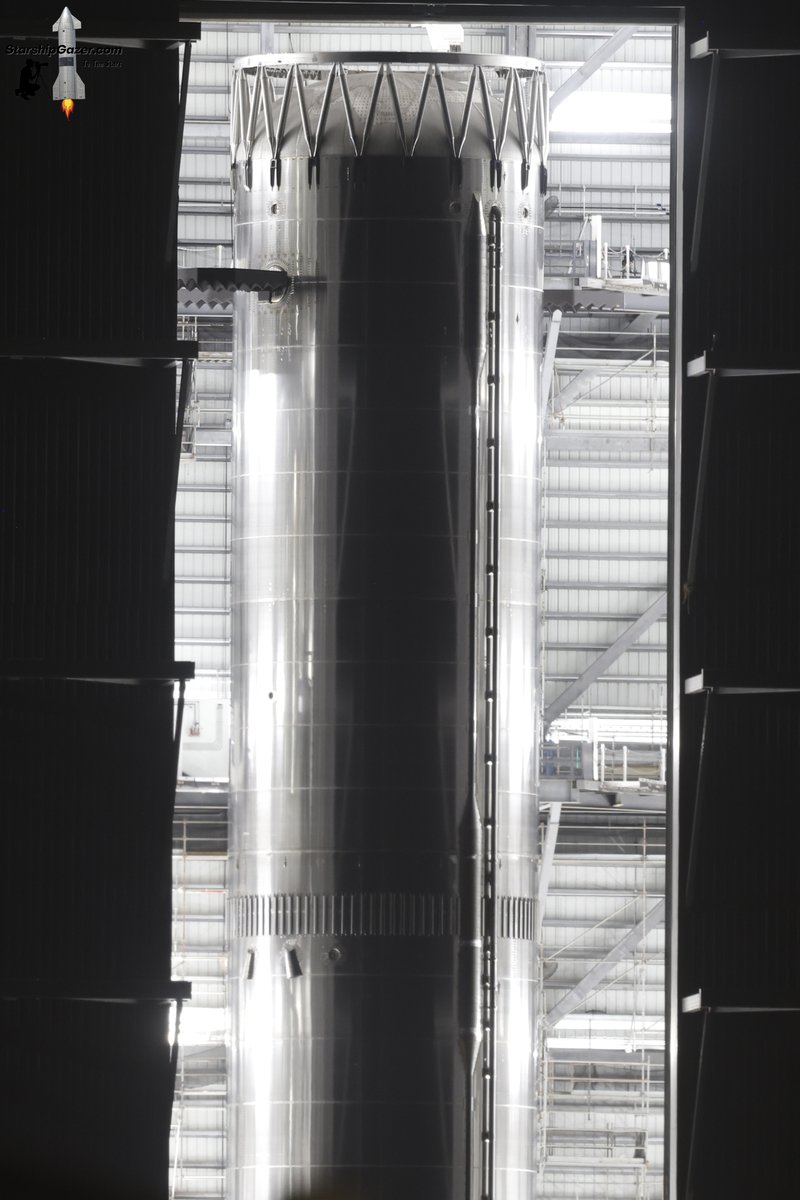 Booster 19 is visible with the new design grid fins and lift/catch pins for the first time tonight ahead of rolling out to the launch complex for testing. 

3/7/26
