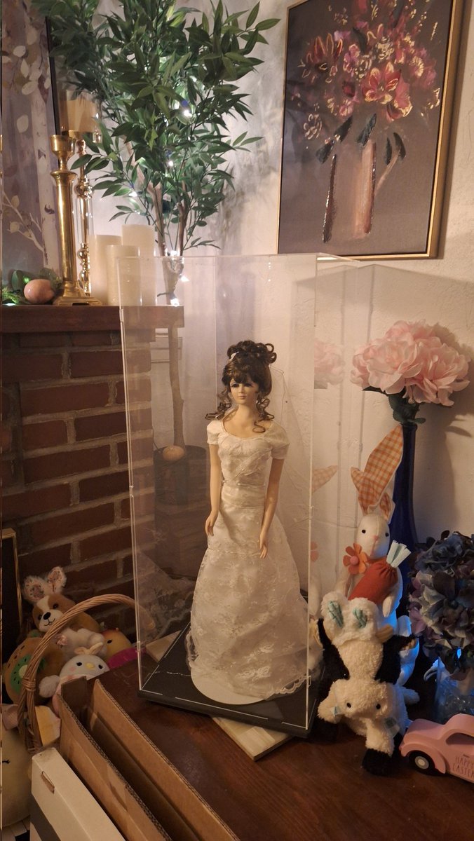 I had to literally hide my bride doll because I was terrified my cats (cough Sweetheart cough) would break her. I finally found a case large enough to hold her that didn't cost a bazillion dollars.

My grandma custom made her to match how I looked on my wedding day.