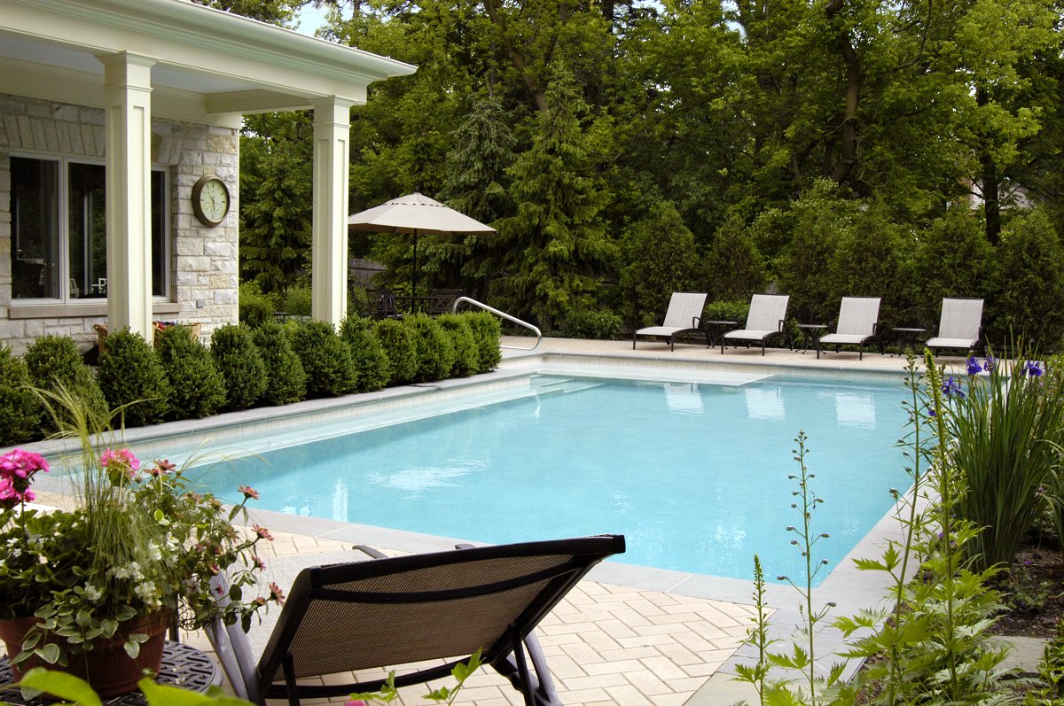 Lake Forest Swimming Pool With Large Sunshelf #marketing #pools #digitalmarketing #landscapedesign #outdoorliving #pooldesigns #swimmingpools #ingroundpools #poolbuildershttps://www.houzz.com/hznb/projects/lake-forest-swimming-pool-with-large-sunshelf-pj-vj~2174000