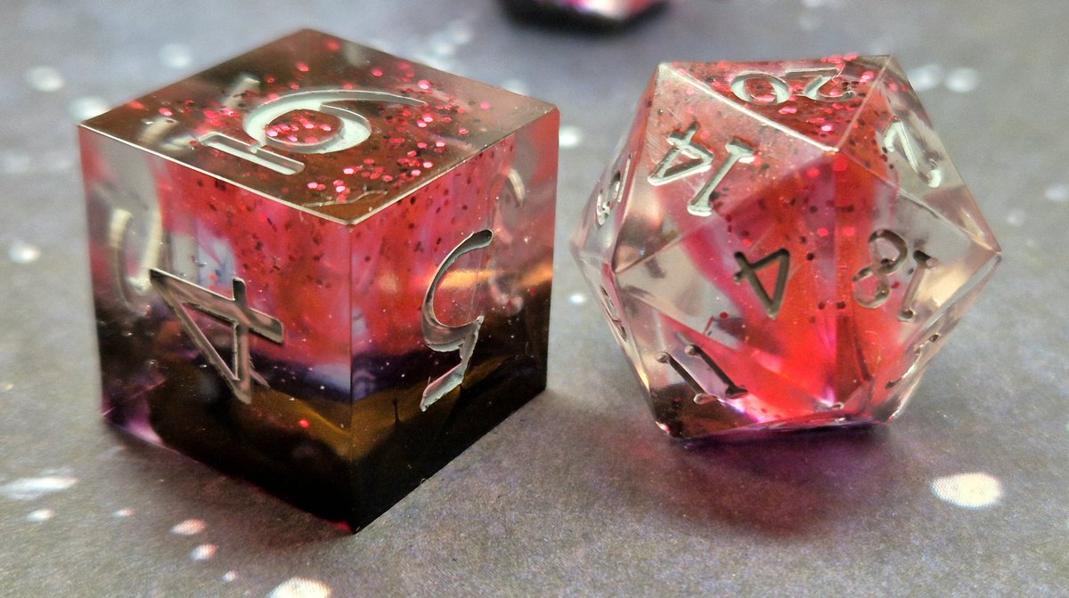 YokoSun92's tweet photo. pt 32 of vtuber inspired dice!

I confess these were made with another vtuber in mind but when they came out of the mold I just thought "these are Ryoma Barrenwort".
So I did grey numbers for his hair! 
Yes they have glitter but Ryoma has a sparkly personality! 
#RyomArt https://t.co/uPB3ARG2Yt