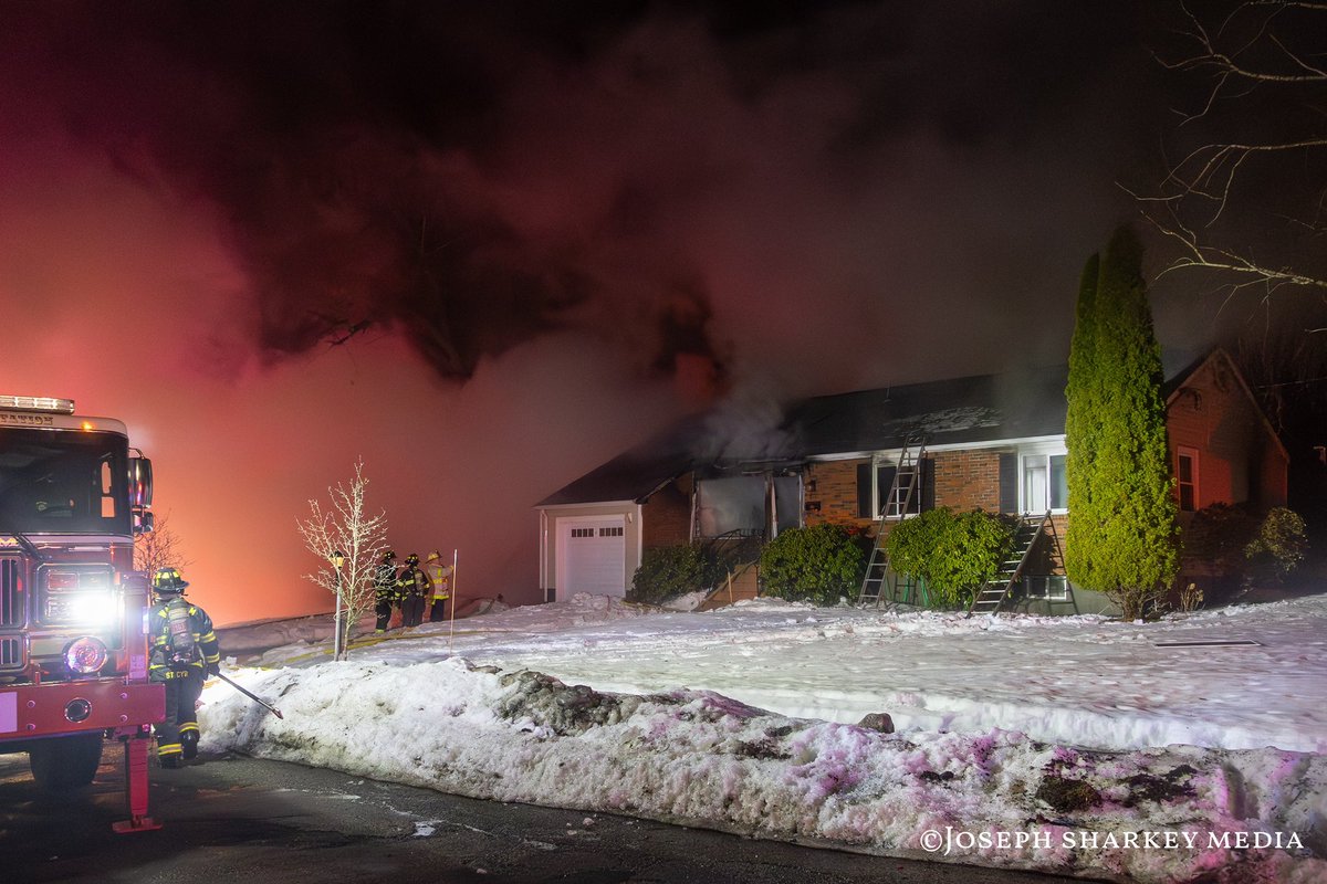 PhotoShark55's tweet photo. Waltham, MA - Firefighters responded to a 2nd alarm house fire at 109 Circle Drive around 12:30 a.m. Sunday morning.
Crews arrived to find heavy fire showing from a 1.5-story single-family home, with flames visible from the garage and roof area. A second alarm was struck shortly after arrival, bringing additional firefighters and apparatus to the scene.
Firefighters stretched multiple hose lines and worked to bring the fire under control while police secured the area.
According to initial reports, one person was evaluated by EMS for possible smoke inhalation. The cause of the fire remains under investigation.