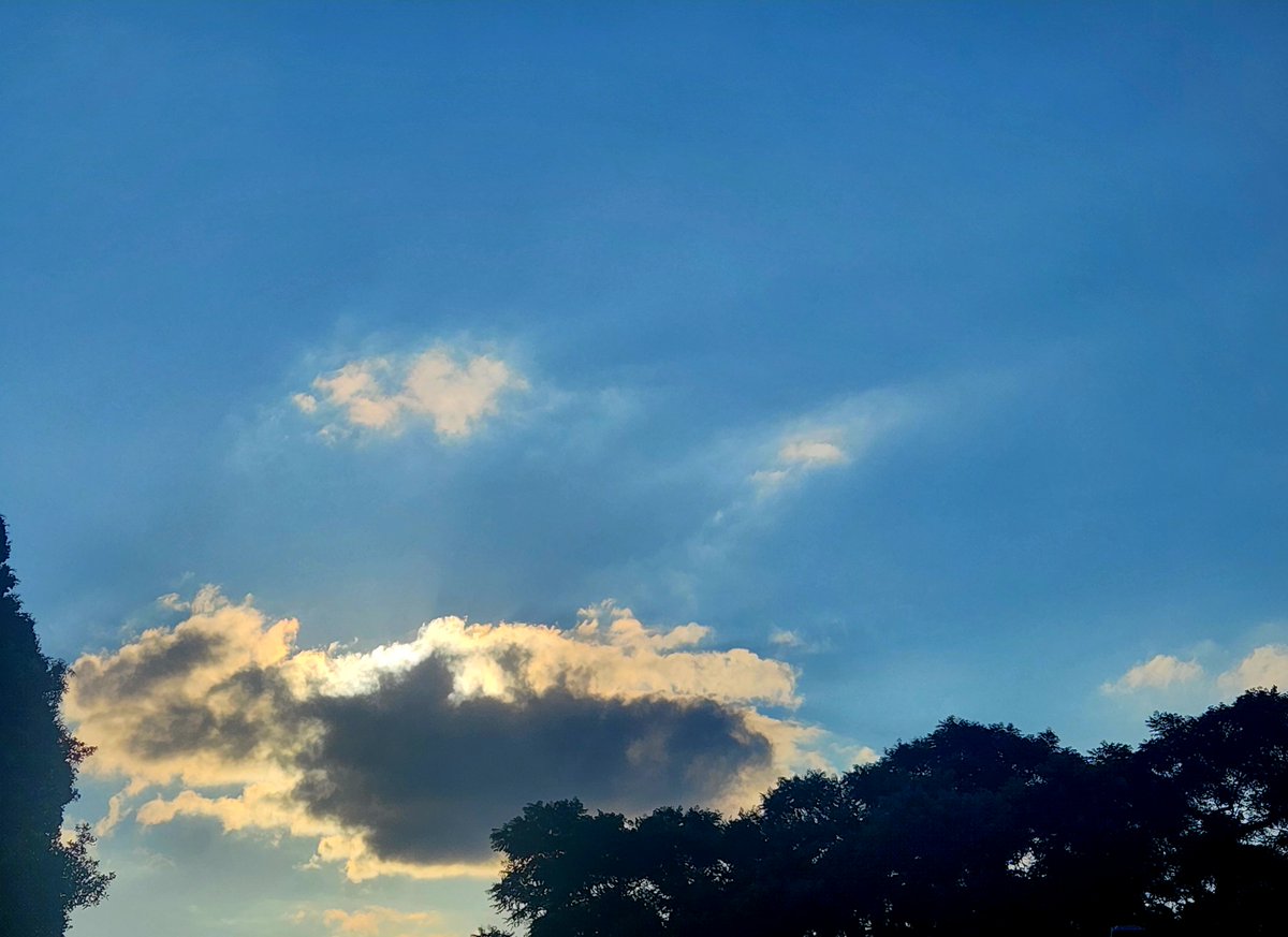 The cloud tried to steal the sky, but the sun quietly signed its name along the edges.