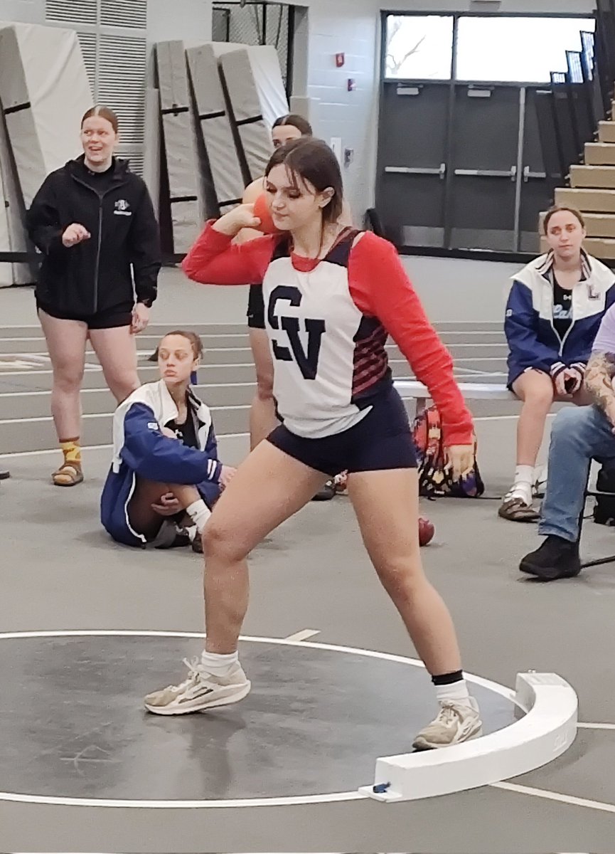 El getting ready to unleash the shot, wearing red in support of last night's Red-Out at the State Hockey Championship game!