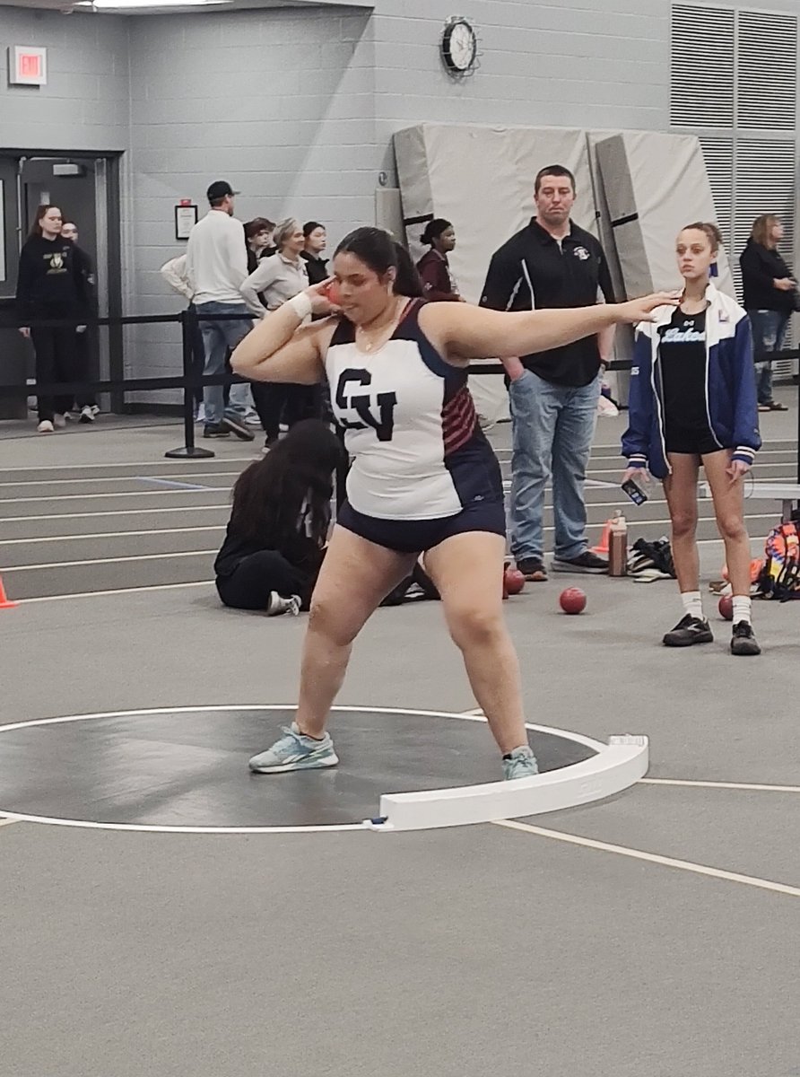 Isabella warming up in heat 2 of the shot put.